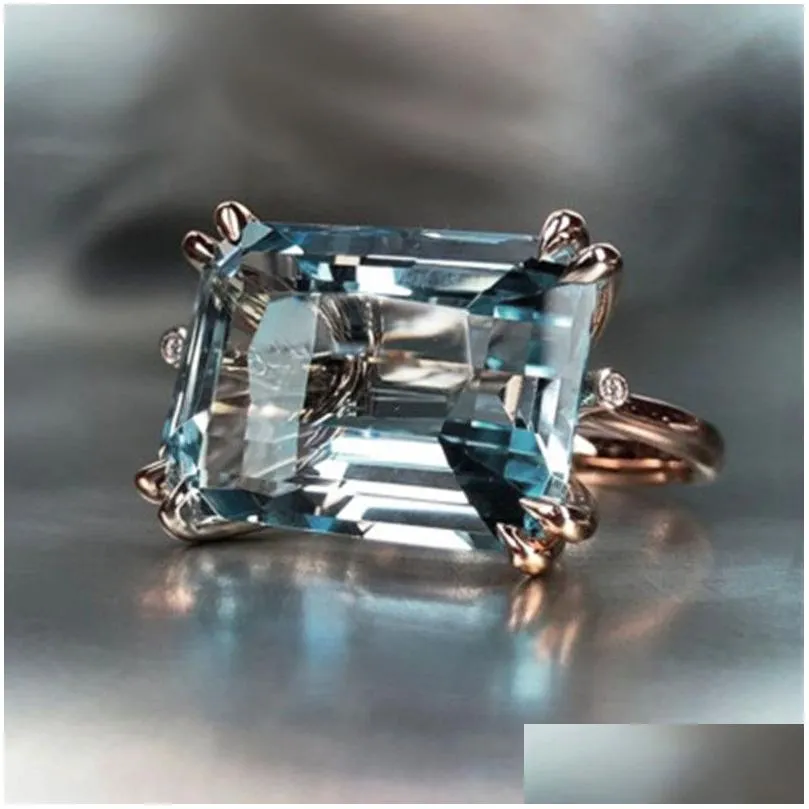 Bandringen 4 Claw Sky Blue Ring For Women Romantic Rose Gold Color Tal rechthoekige vorm Fashion Girl Drop levering sieraden Dh4mo