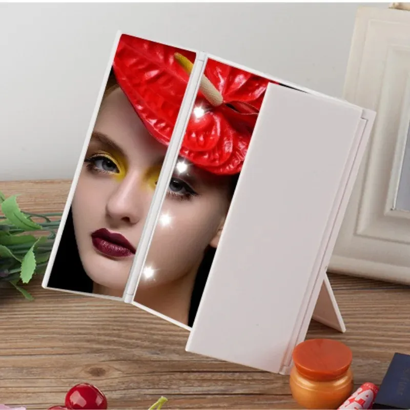 Nouveau miroir de maquillage de lumière à LED portable Lumières de vanité compacte COMPACT MIRMORS DE POCKET Vanité Cosmetic Pliant Miroir LED LED lampe à LED pliant lampe à lampe à la main