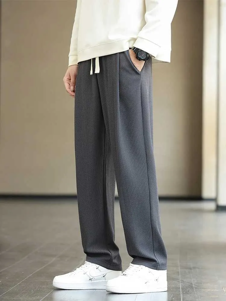 Męskie spodnie Fall 2023 Męskie spodnie sportowe z paskiem szeroką nogę proste Paski Spodnie Spodnie plus wielkości męskie luźne spodnie 8xl J240429