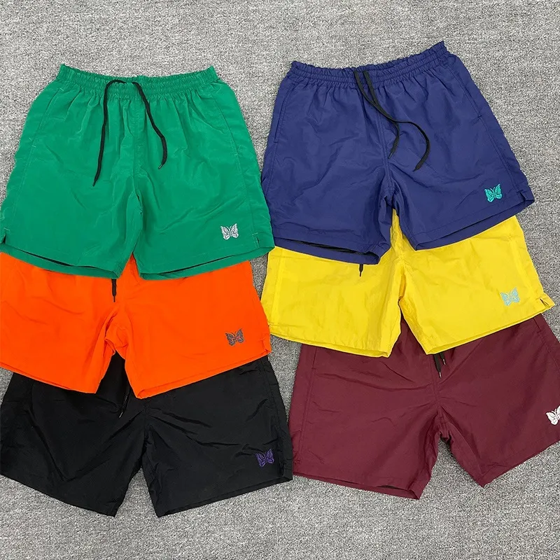 Herr shorts mode nylon män kvinnor vattentät snabb torr inuti mesh fjäril broderi byxor grön orange