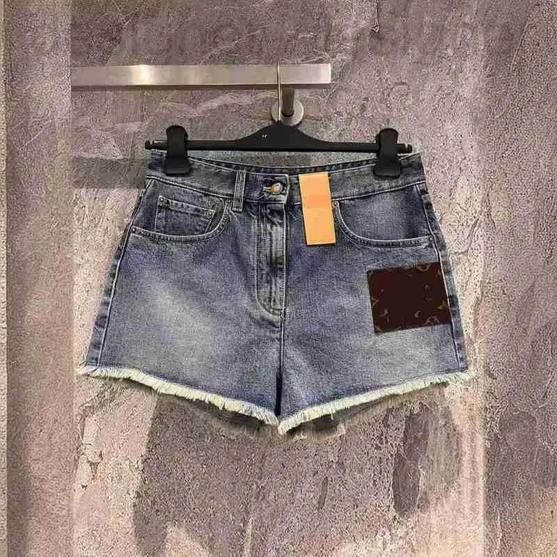 Kvinnors shorts designer märke 24 vår/sommar nyålder reducerar temperament mångsidig hög midjepanel läder gammal blommor pälskant design tvättad denim y52h