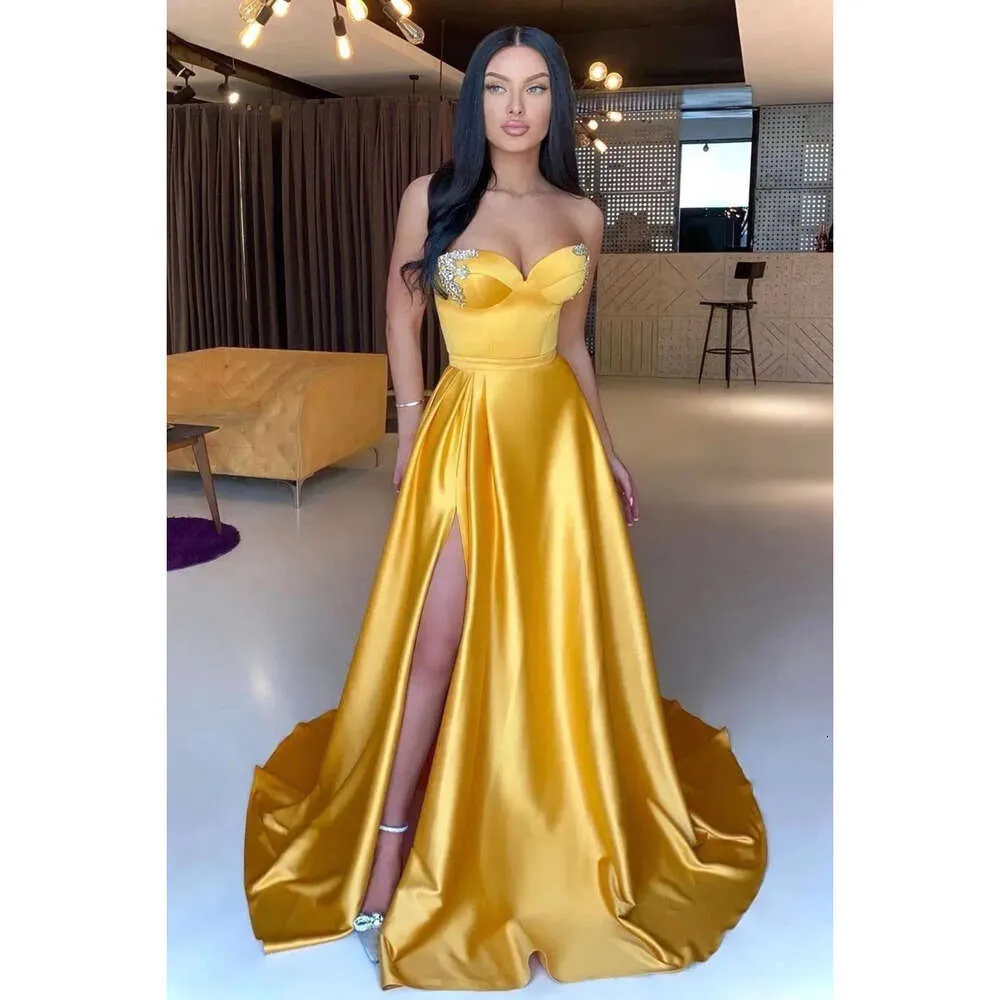 gold yellow dress The Golden Dress – Dona Matoshi main image 0