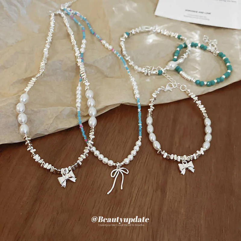 Armband halsband minimalistisk pärla ris pärla båge set unik designkänsla krage kedja fashionabla ny halschain för kvinnor