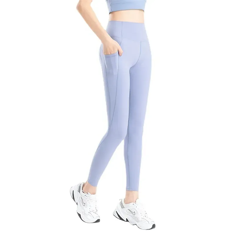 LL-3952 Kvinnor Yoga Leggings Pants Fitness Push Up Training Running med Side Pocket Gym Seamless Peach Butt Tight Pants