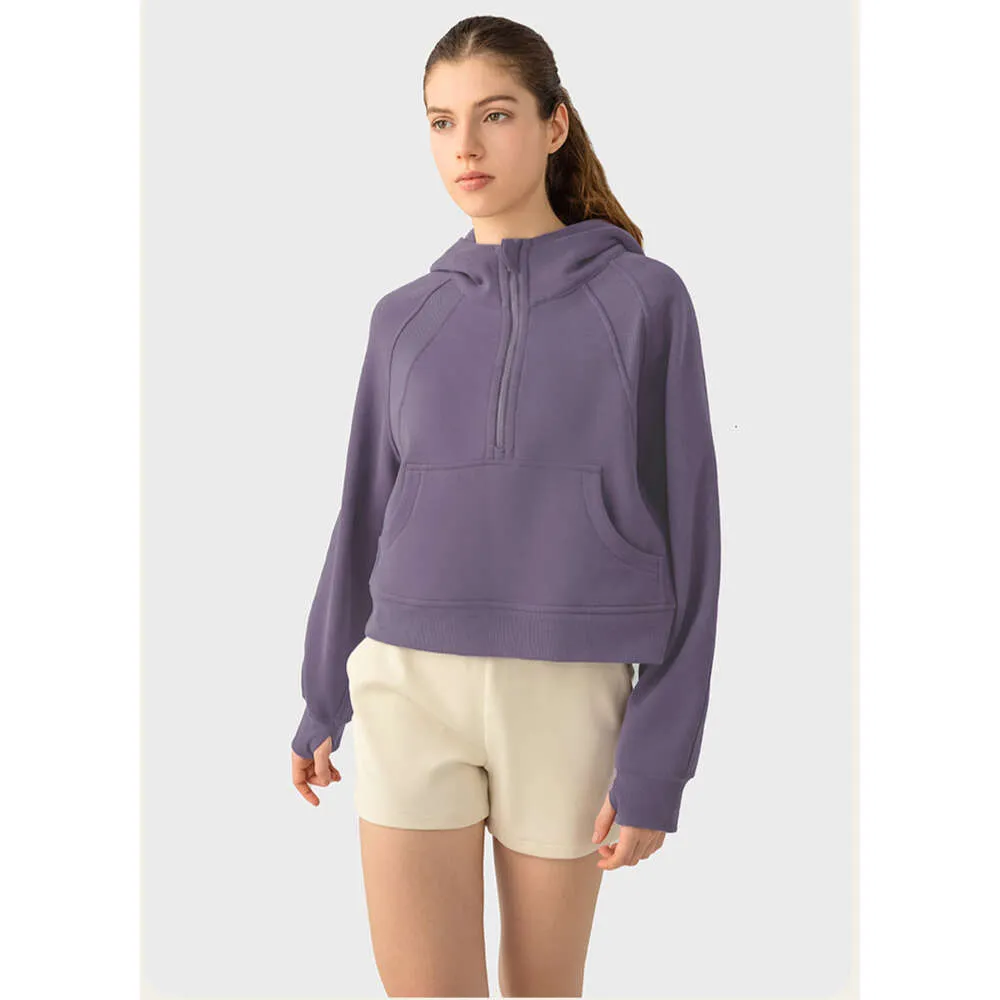 "Stay stylish and comfortable during your yoga sessions with our Women's Sports Coat Fitness Hoodie - a trendy loose fit jacket with a half zipper."