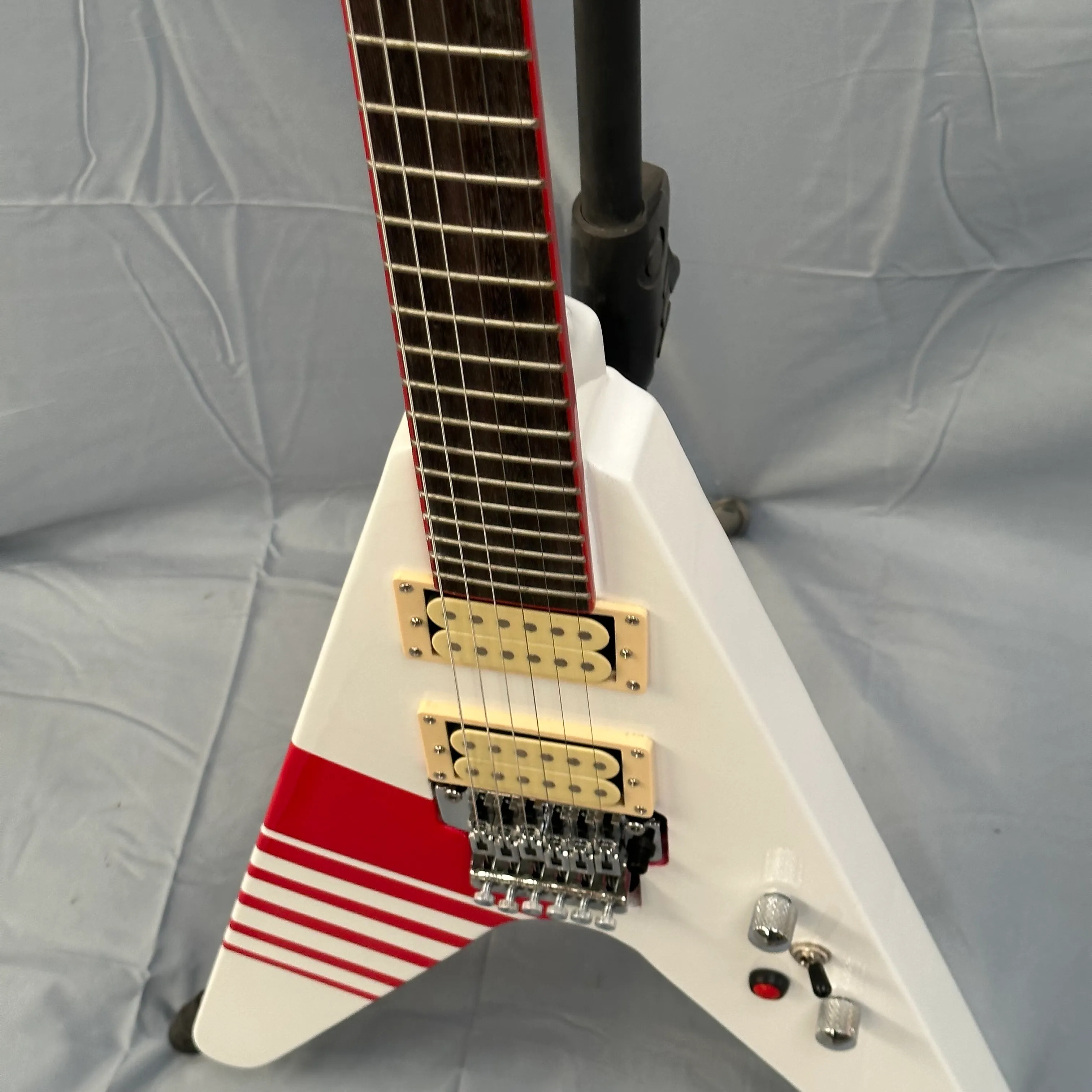 DHgate.com:Striking White V Electric Guitar with Red Stripes