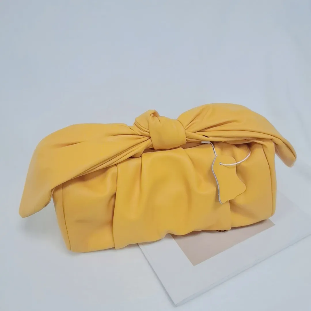 Street photo designer's bow handbag 2023 spring/summer new satin handbag pleated cloud bag single shoulder diagonal cross handbag versatile leather yellow
