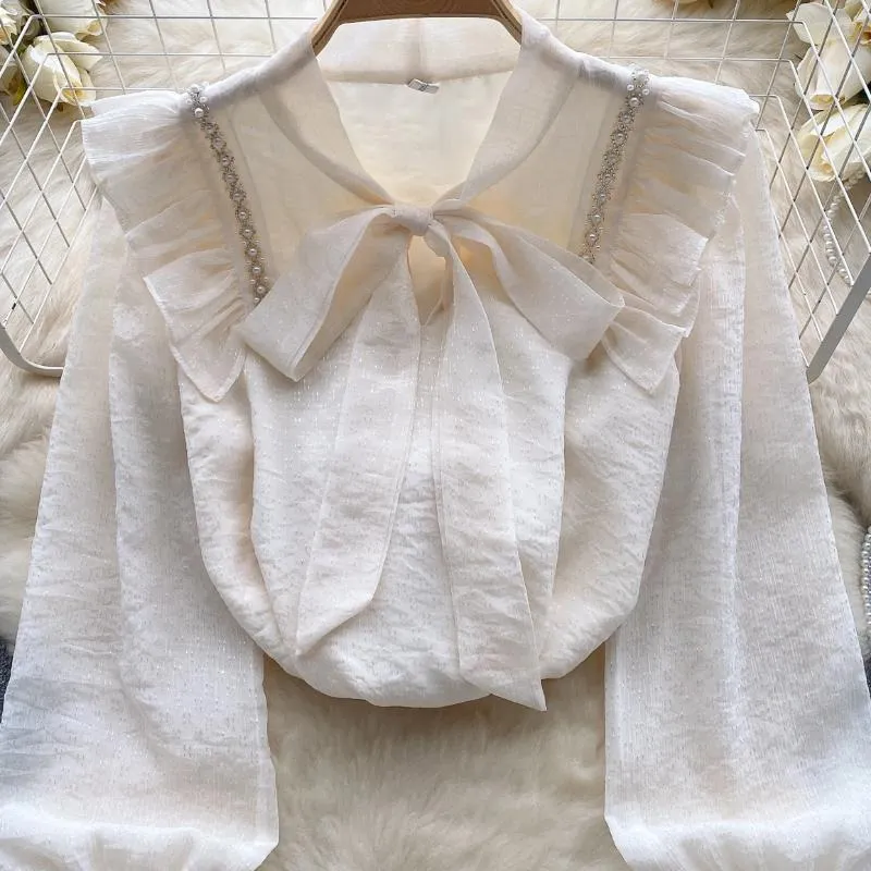 Kvinnor Bluses Korean Luxury Pärled Bubble Sleeve Shirt Blus Autumn and Winter Bow Tie Ruffles Sweetheart Top