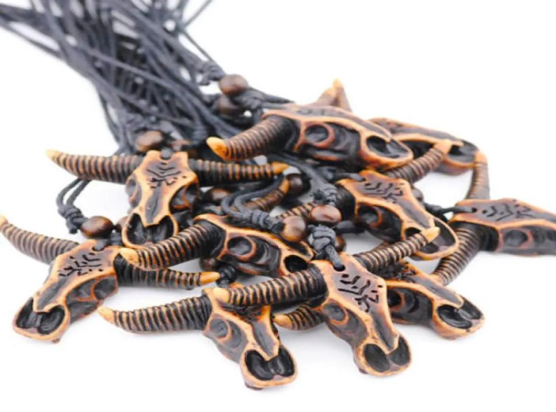 Jewelry Whole 12PCS Cool Boy men039s Brown Simulation bone carving Bull head skull Pendant Necklace Gift5029510