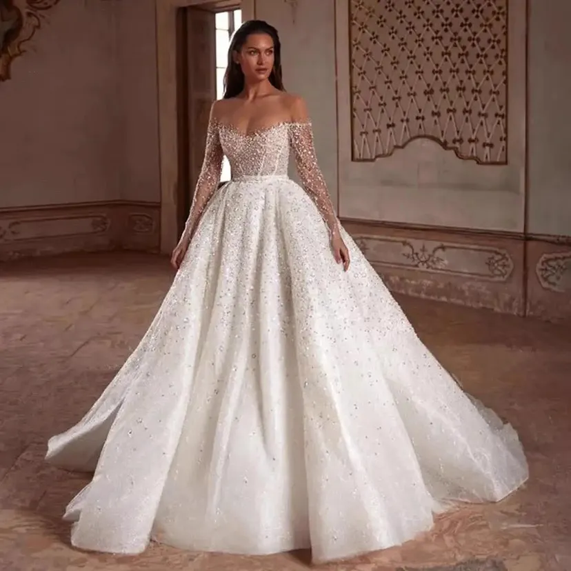 2024 Abiti da sposa scintillanti glitter Abiti da sposa maniche lunghe in pizzo con paillettes Robe de Mariage collo trasparente fatto a mano vestido de novia Abito da sposa sexy africano di lusso