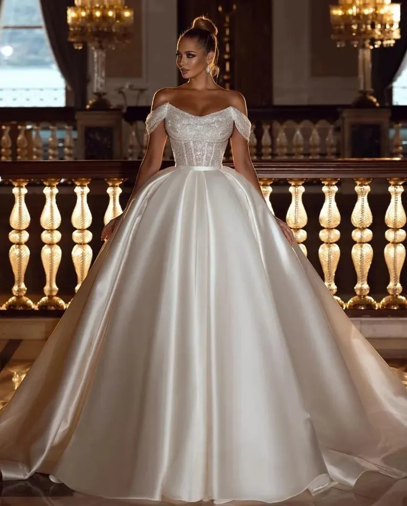 Robes de mariée de robe de bal de paillettes scintillantes avec train de satin détachable élégant hors de l'épaule Dubaï arabe moderne robes de mariée Robe de