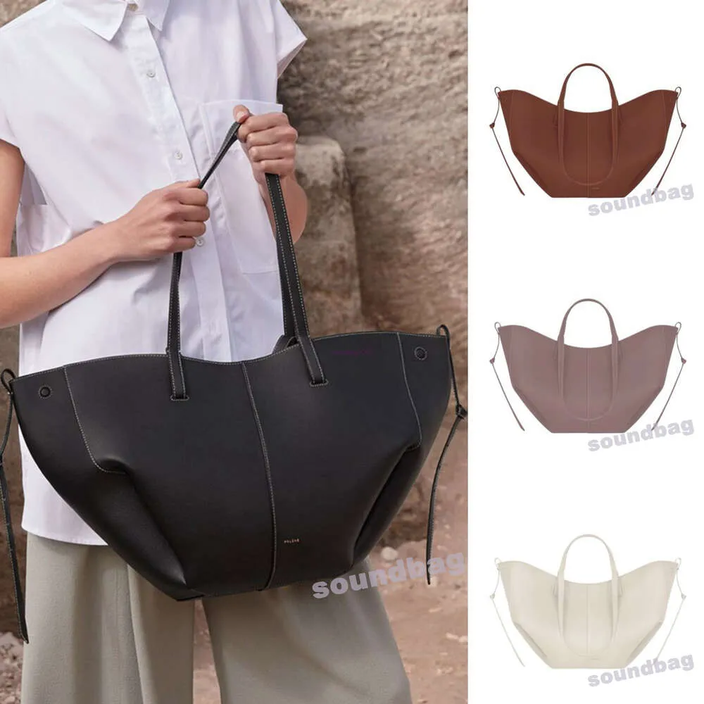 Véritable peau de vache 10A Cyme Tote - Seau design ailé Élégance française Double options de transport Sac à main de créateur en cuir véritable grande taille shopping sac à bandoulière hobo souple berii