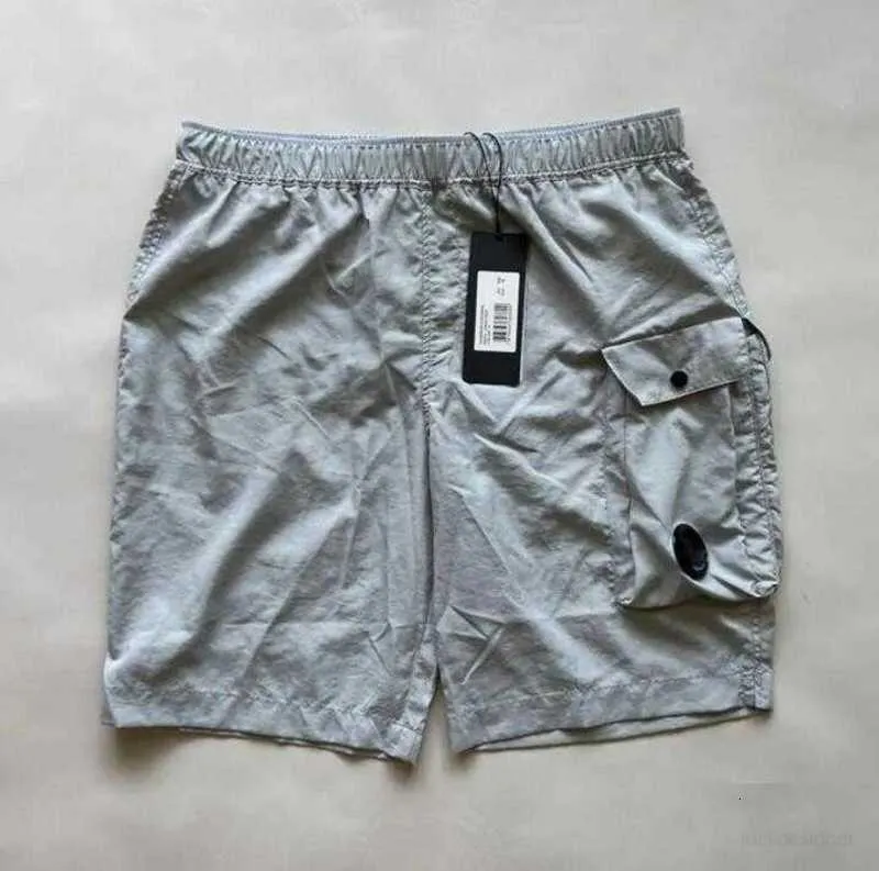 Projektant Europe Designer One Lens Pocket Pants Shorts Casual Dyed Beach Short Spit Bidshorts Swim Shorts Outdoor Jogging Rozmiar MXXL Black CP Designer55pd