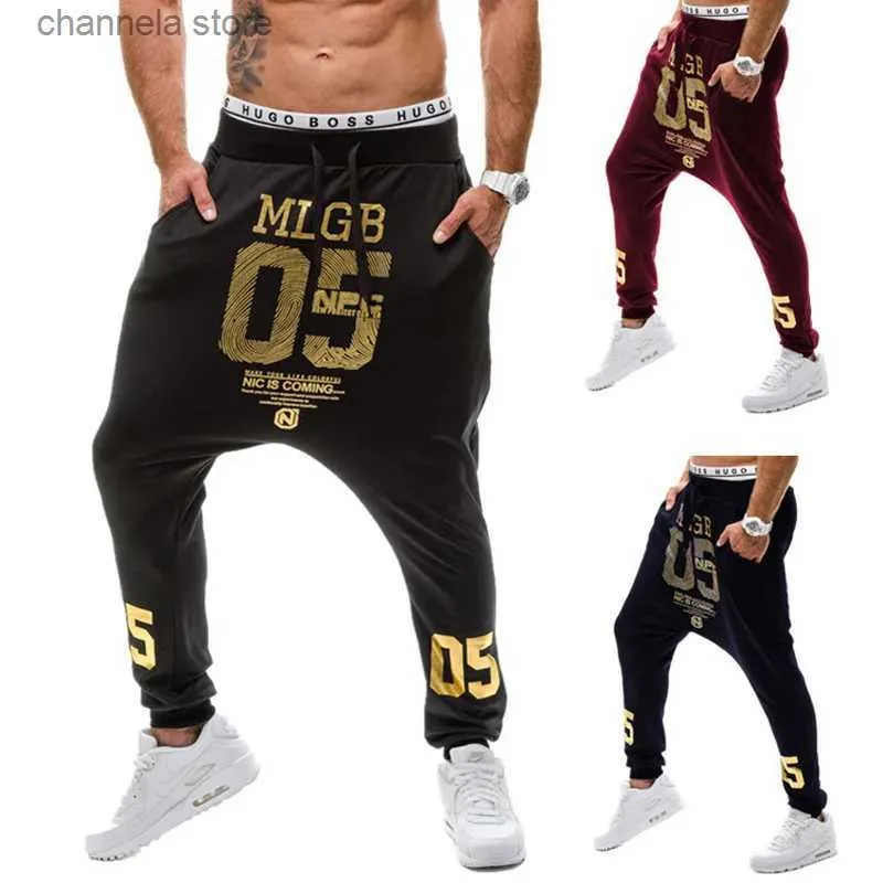Calças masculinas novo 2021 primavera outono casual baixa virilha hip hop feixe pé perna calças streetwear dança de rua número ouro impresso calças masculinas t240229