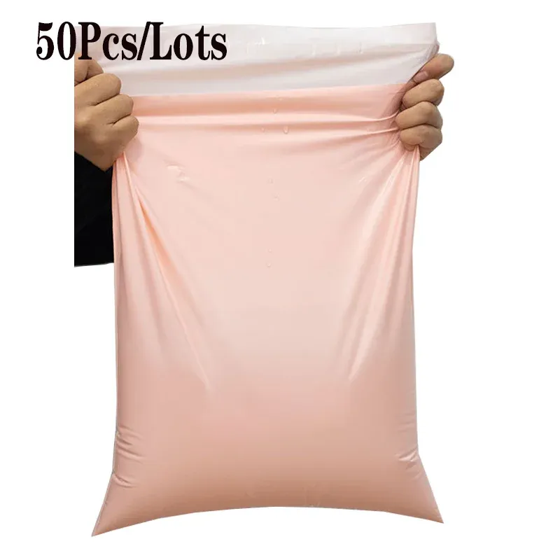 Koperty 50pc / paczka pe z tworzywa sztucznego worki wysyłkowe różowy kolor wodoodporności worka do przechowywania