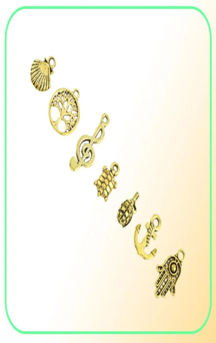 Diseños mixtos Retro Color dorado llave timón Shell tortuga pájaro mano torre bicicleta mariposa búho encantos para joyería DIY montaje 50pc8702415