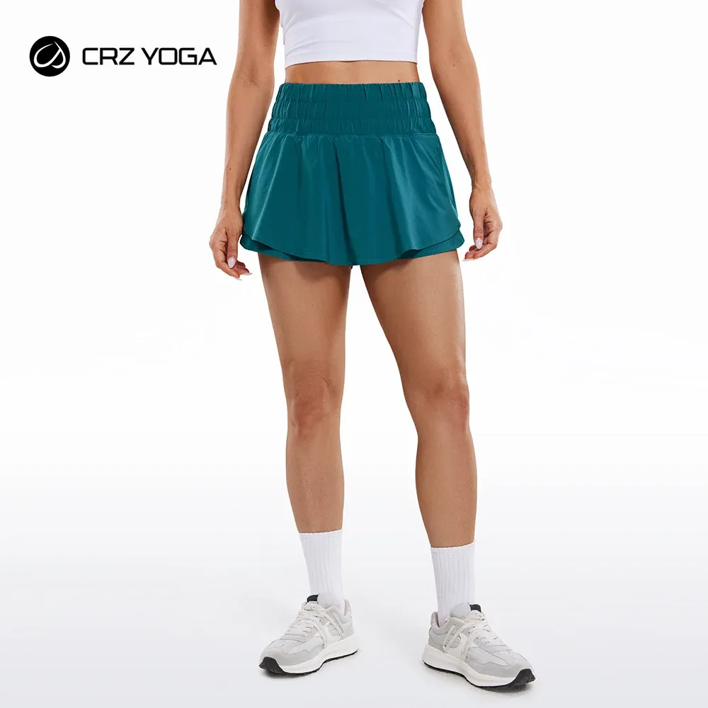 Shorts CRZ YOGA feminino cintura alta fluido atlético shorts saia com babados forro frontal treino shorts de corrida com bolso com zíper