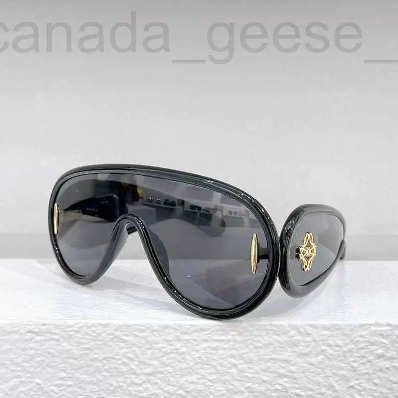 Lyxiga solglasögon coola L W40108i Glasögon för män och kvinnor Ny vingformade en bit lins anti bländning bll4
