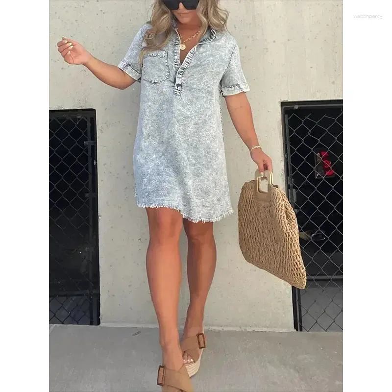 Women's casual denim dress with splice tassel pockets, loose fit, and distressed design.