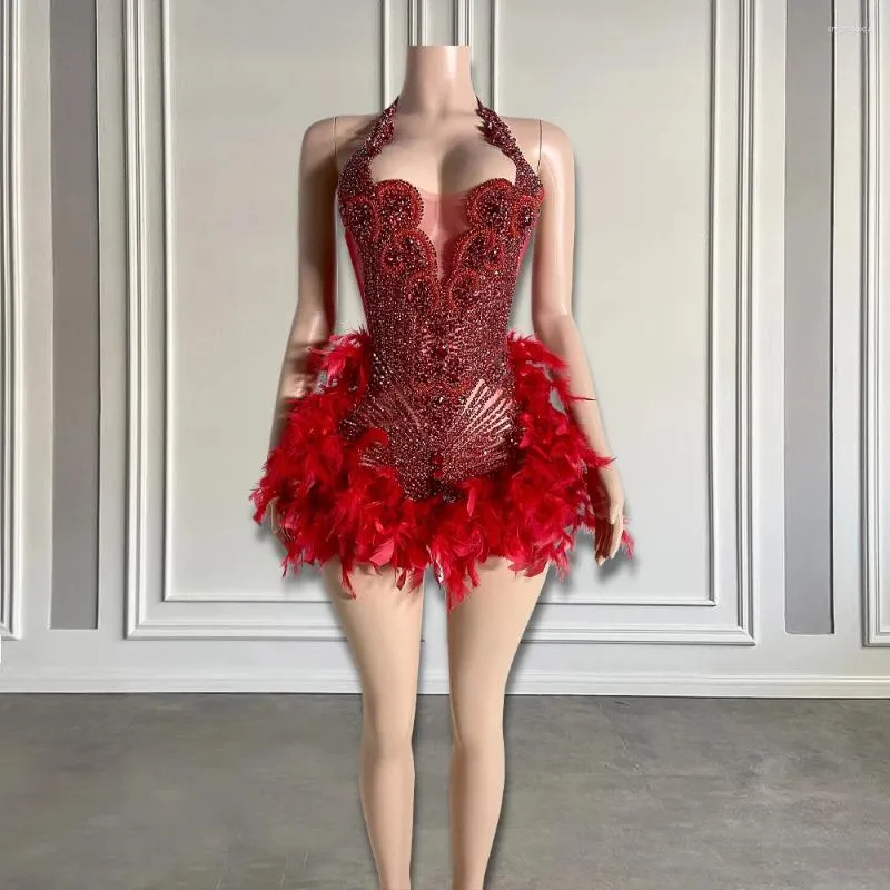 Glamorous Evening Gown with Shimmering Bronze Sequins and Vibrant Orange Feather Skirt