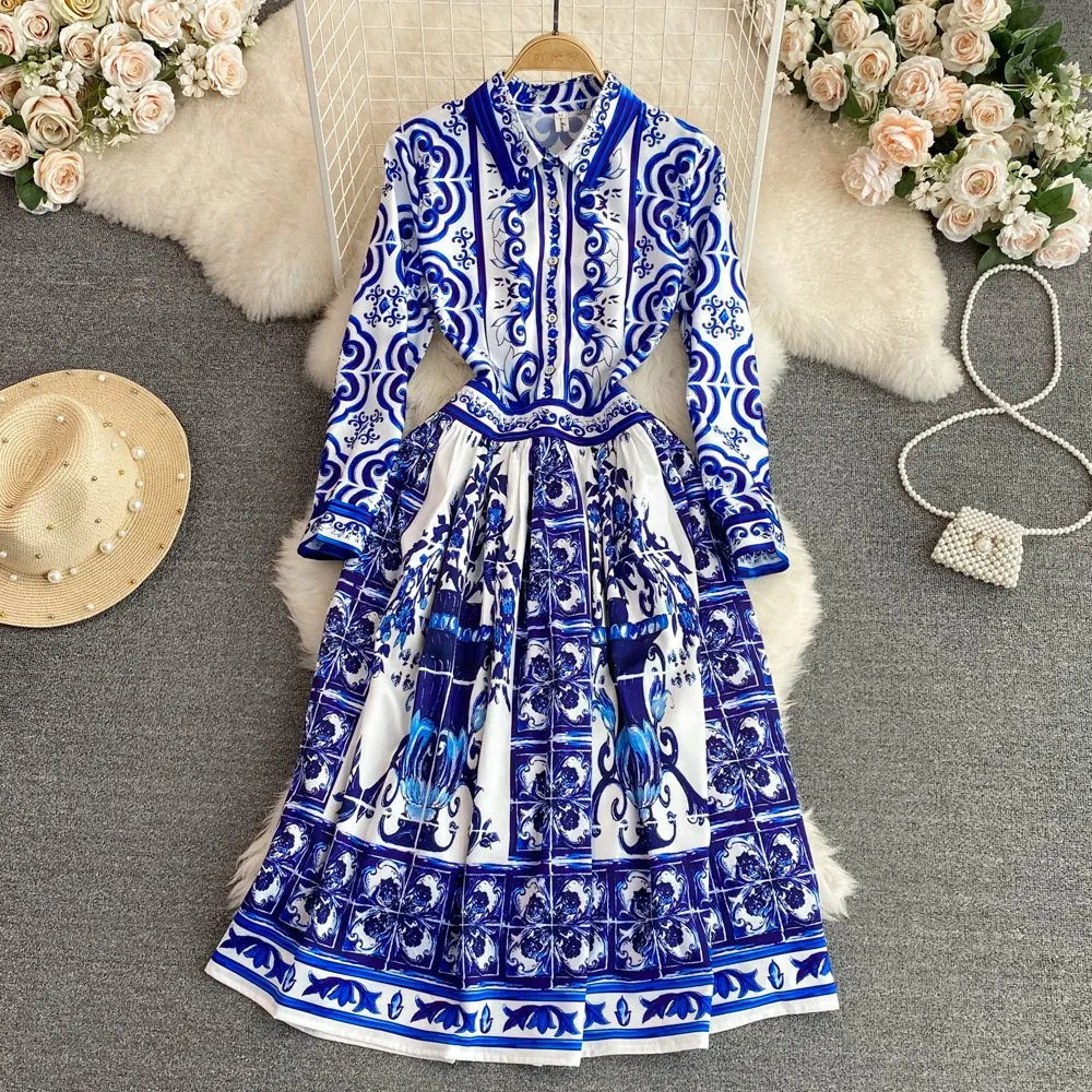 blue and white midi dress with sleeves Aylaya Godthab Vibrant Blue & Ivory Cotton Tropical Print Midi Dress