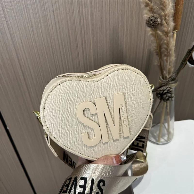 【THE MUSEUM VISITOR】HEART STUD MINI BAG (SILVER) DHgate.com:2024Womens Mini Heart Crossbody Bag - Stylish