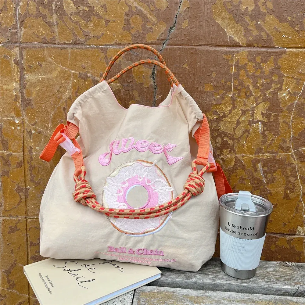 DHgate.com:2024Kawaii Ball Chain Canvas Embroidery Bag
