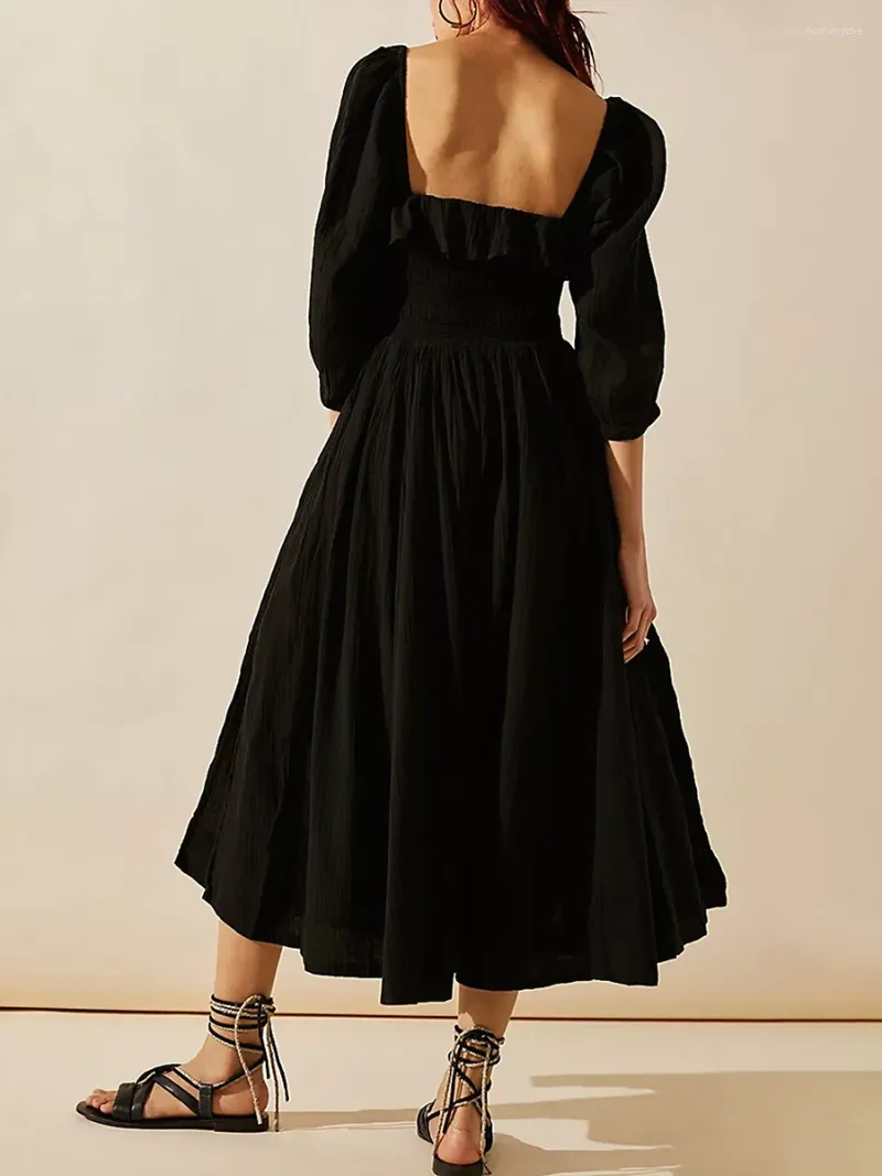 Elegant Black dress with ruffles, solid color, and flowy style for women. Elegant Black dress with ruffles, solid color, and flowy style for women.