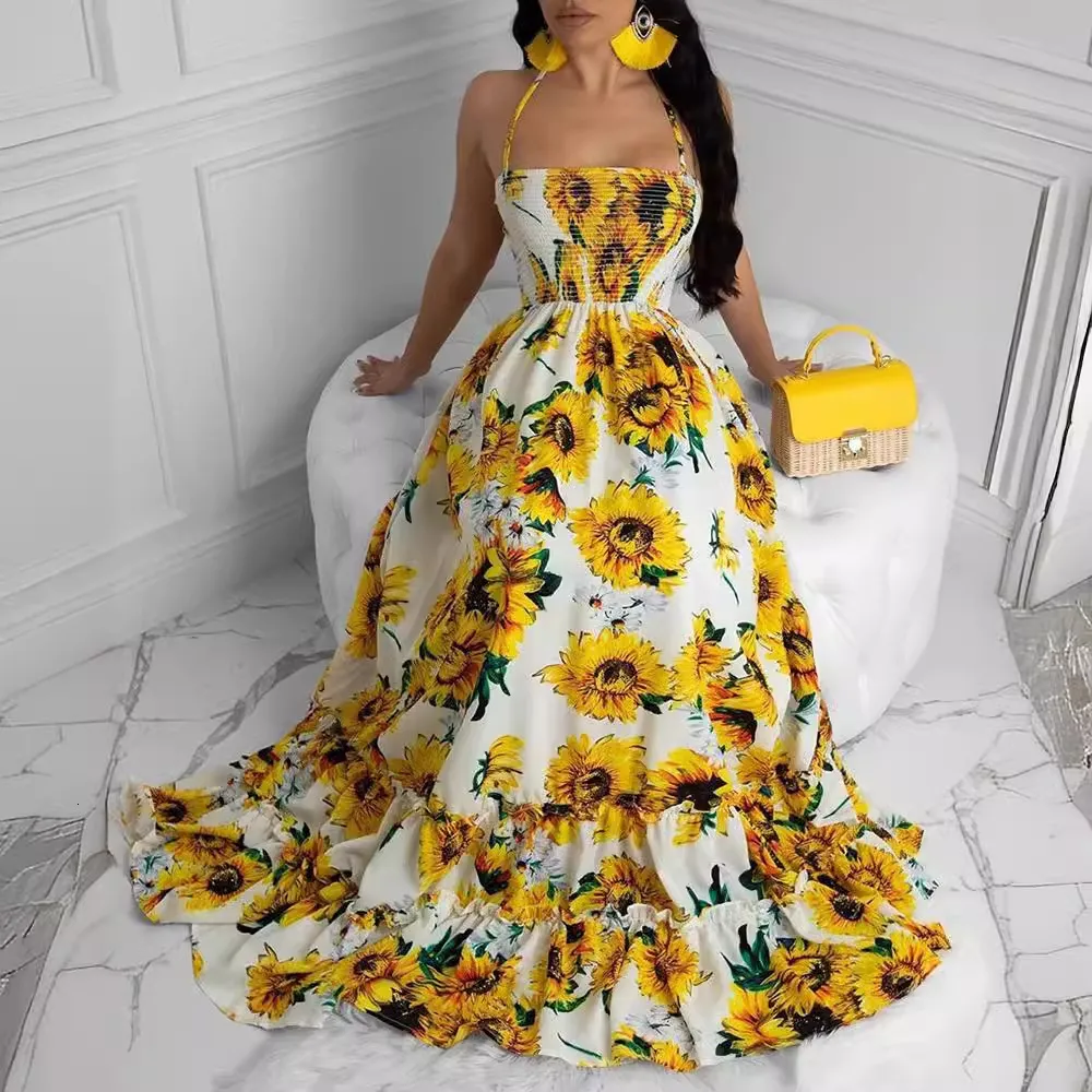 day dress in lemon yellow cotton with stylized sunflower print Vintage Summer Sunflower Print Sleeveless Maxi Dress with Hatler Neck and boho swing Detail