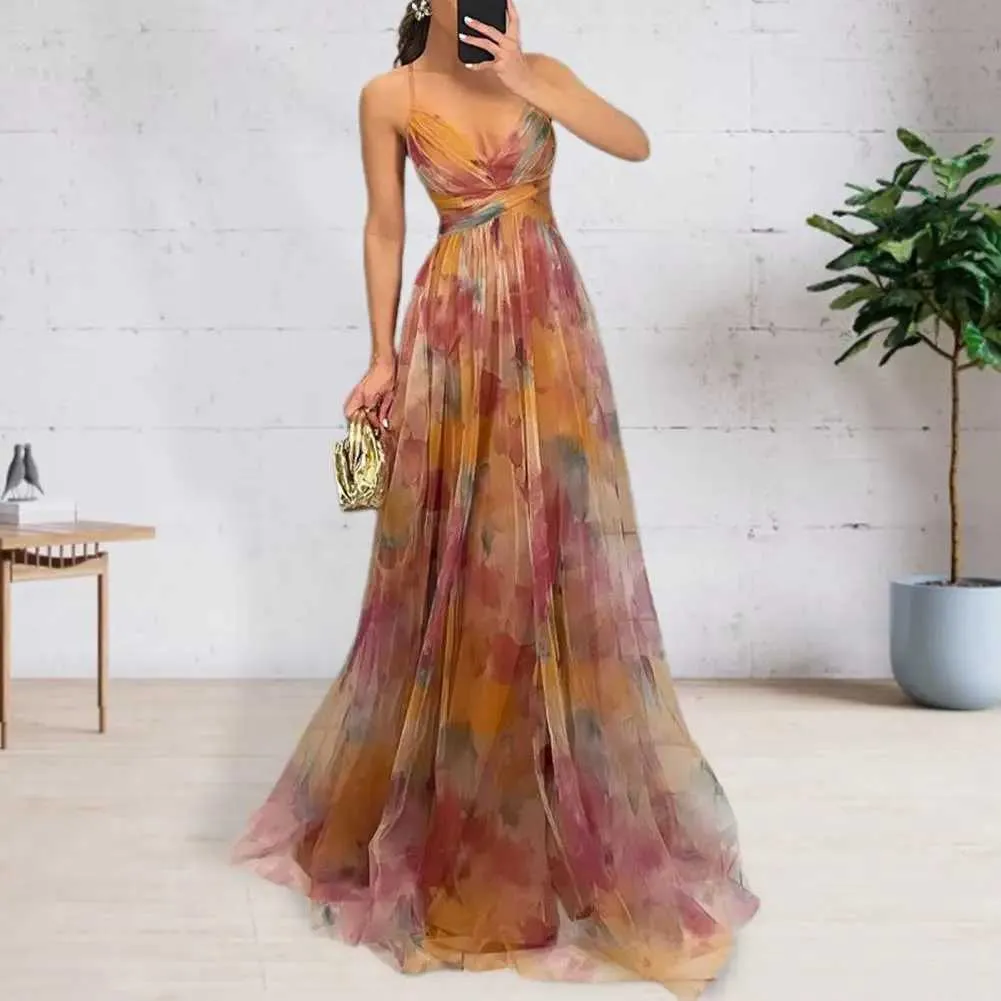 Product Title: Colorful Printed Women's Long Flowing Maxi Dress with Low-Cut Spaghetti Straps and A-Line FitColor: Graded Color Pattern (Orange,