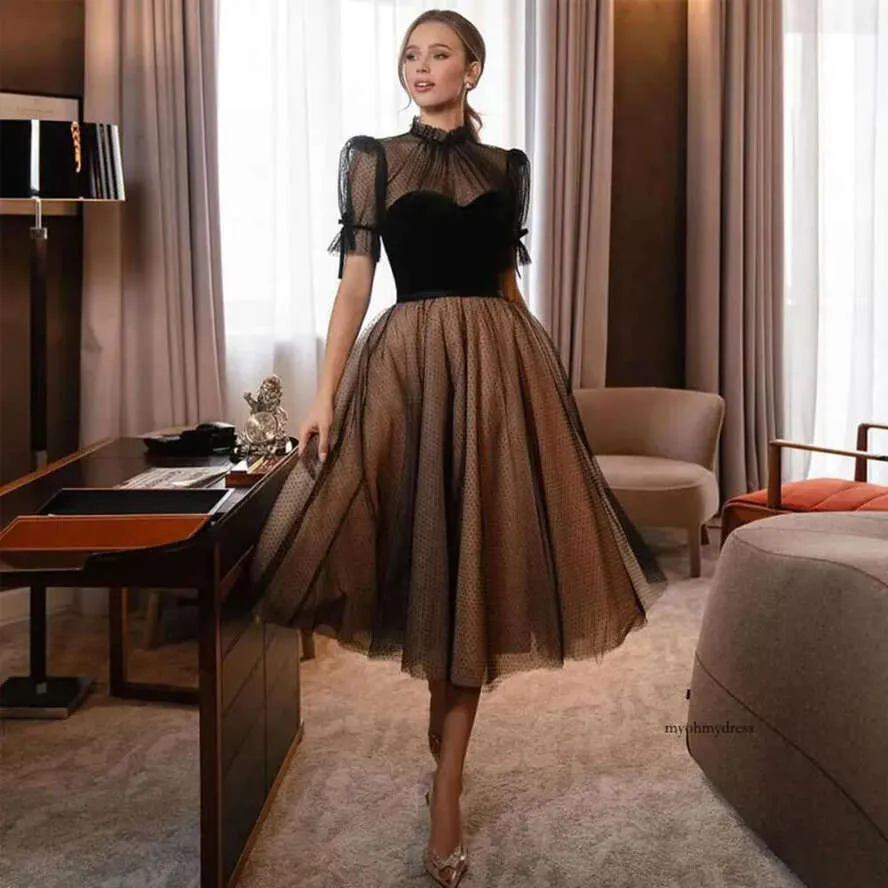 Elegant Black Tulle Midi Dress: Sheer Sleeves, High Neck, Tea Length. Shop Now! from Dhgate Prom Dresses - price 179.83 Elegant Black Tulle Midi Dress: Sheer Sleeves, High Neck, Tea Length. Shop Now! from Dhgate Prom Dresses - price 179.83