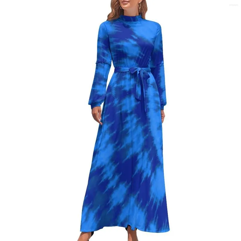 Colorful tie-dye maxi dress with bright light print and elegant high neckline. Colorful tie-dye maxi dress with bright light print and elegant high neckline.