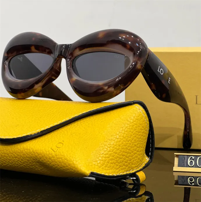 Gafas de sol de diseño de lujo de moda para mujeres y hombres, gafas con el mismo marco de gafas de sol para la playa y la calle Cat Eye con caja de regalo