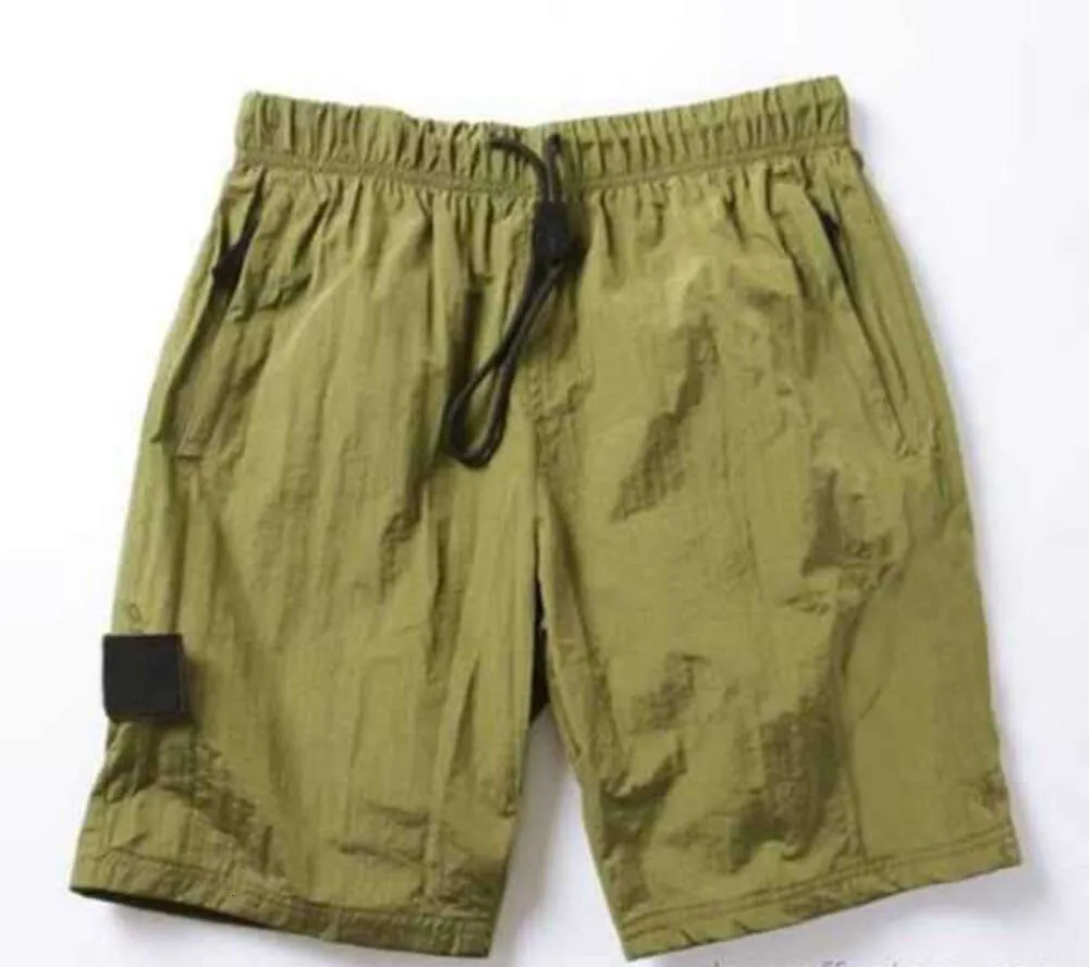 Pantaloncini estivi da spiaggia 2023 Pantaloni corti da uomo Moda da corsa Sciolti Processo di lavaggio ad asciugatura rapida di tessuto puro Trendy Casual Hip-hop Ins Stones Island Tempo libero design22ess