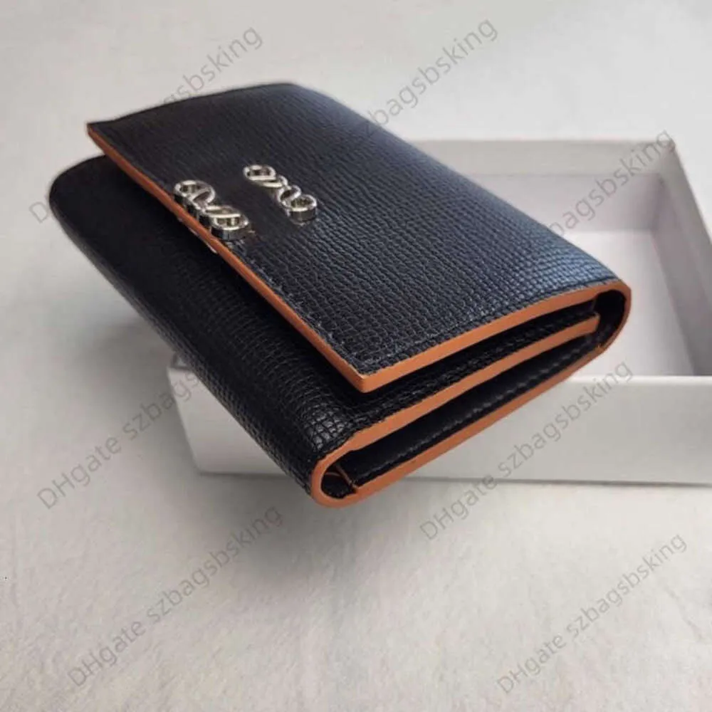 Designer Wallet Kleine kaarttas Echt lederen Korte Wallet Licht Luxe Luxe Geometrische letter Buckle Three Mold Money Clip One Piece modieuze en eenvoudige wijzigingsbeurt