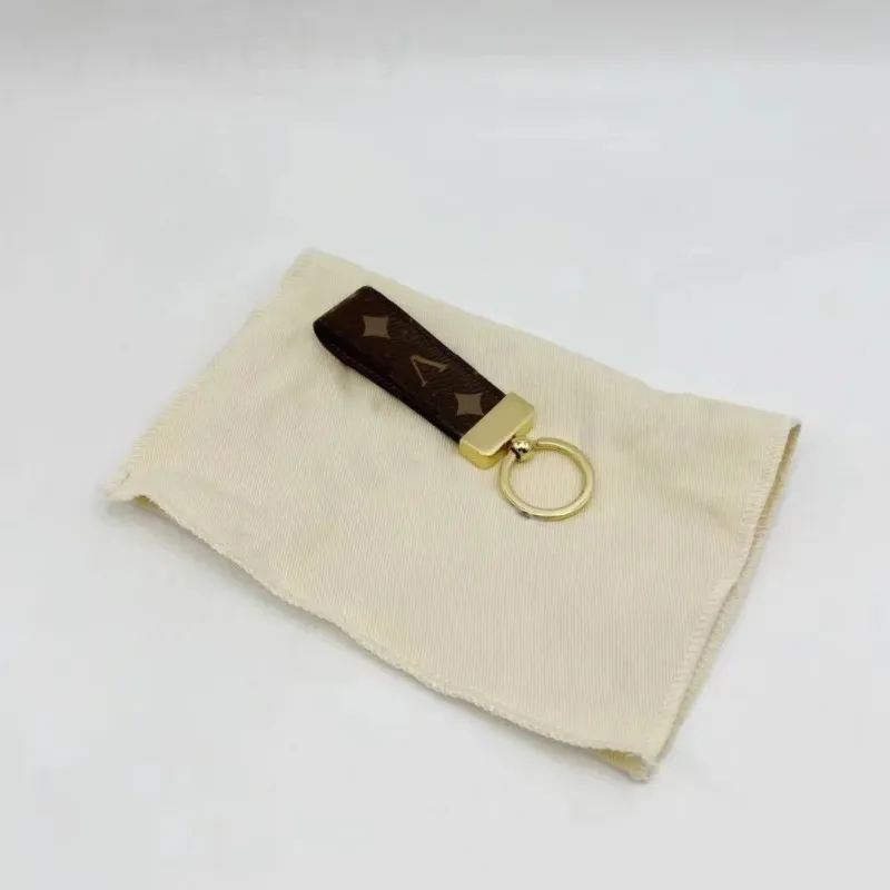 Brown keyring designer bag wallet luxury keychains popular letters plaid solid color car key charms portachiavi leather dragonne luxury key chain small PJ047 Q2