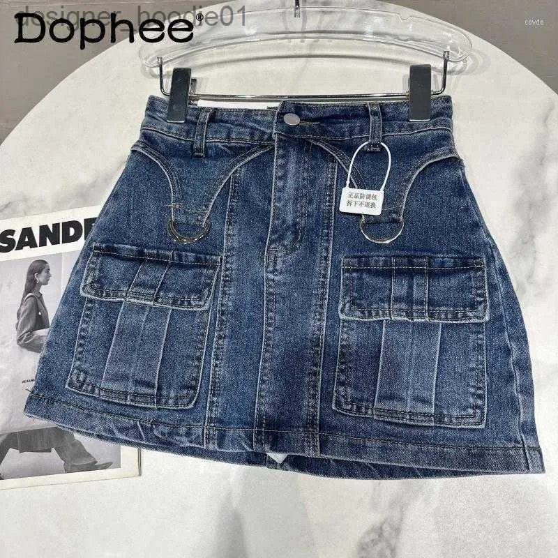 Jupes Jupes 2023 printemps anneau en métal Cargo poche conception lavé Denim hanche enveloppé jupe courte femmes a-ligne gaine Jean Mini rue L230912