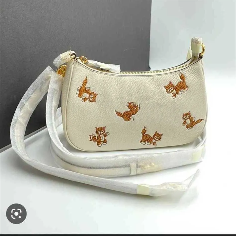 C-väska söt katt underarm tygsäck designer väskor tryck armhåla axel liten mahjong lychee korn kohud handväska handväska 230420