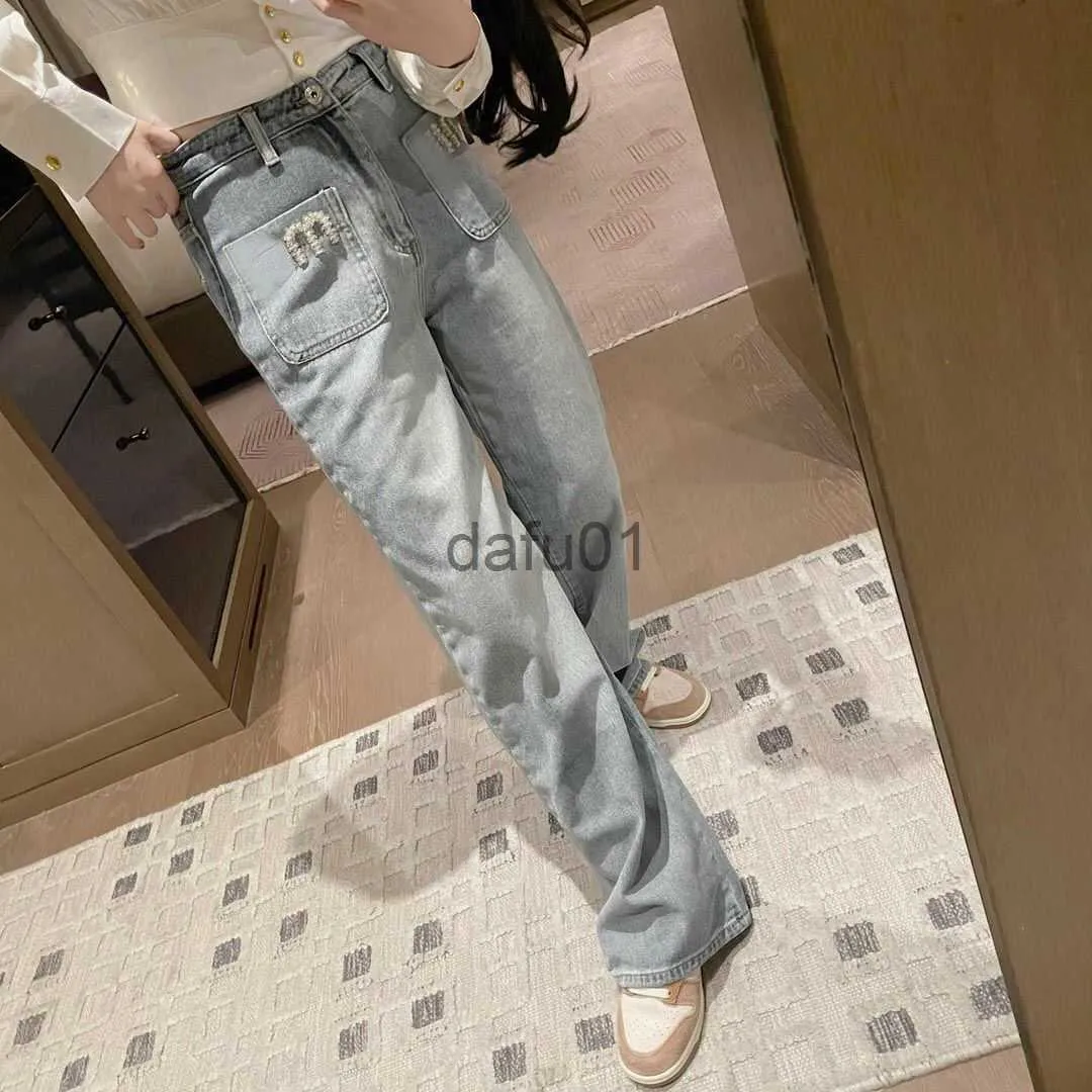 Jeans pour femmes Jeans de créateur Poche à ongles Lettre de perçage Pantalon en denim brodé Printemps Taille haute Jambes larges Jeans en détresse Vêtements pour femmes x0914