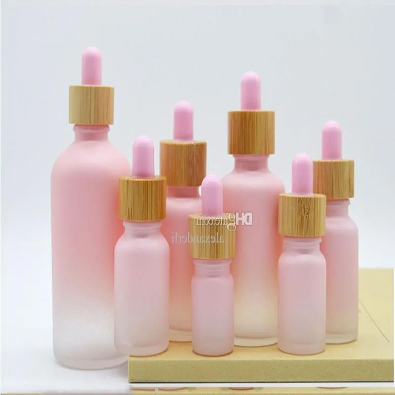 Flacone contagocce in vetro smerigliato Pipetta a goccia Colore rosa con tappo in bambù Flacone di olio essenziale da 1 oz 5 ml 10 ml 20 ml 30 ml 50 ml 100 ml Imballaggio Cas Frjv