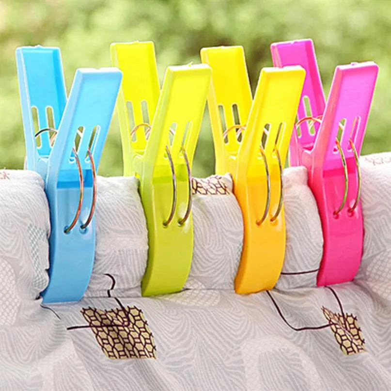 4pcs Plastic Plastic Color Clips пляжные полотенце зажим, чтобы предотвратить ветер.