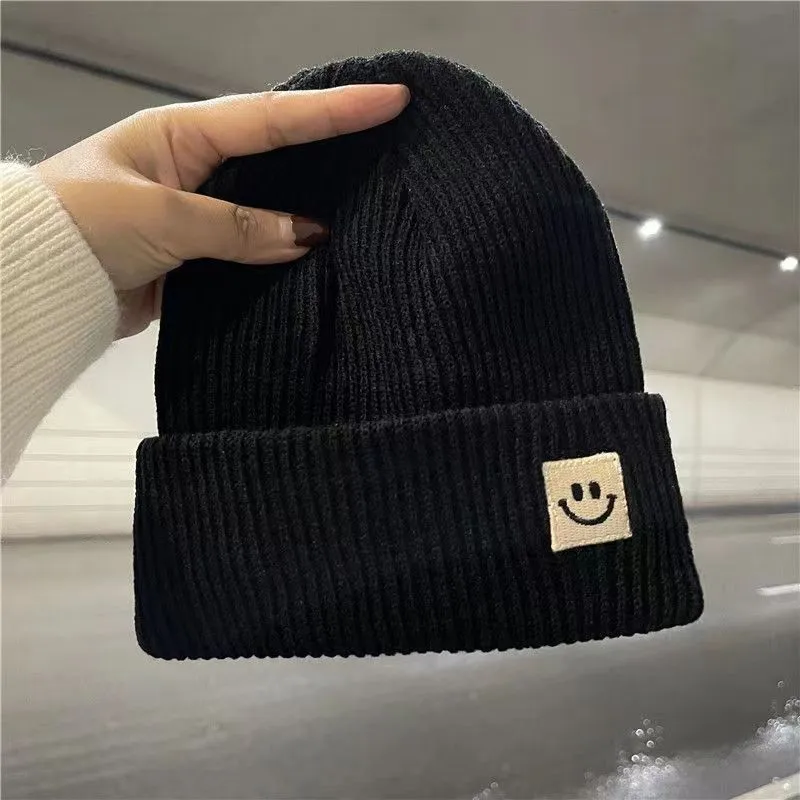 Net red knitted hat smiley face marked hair baotou line hat women autumn and winter cute trend all wear warm pullover hat men