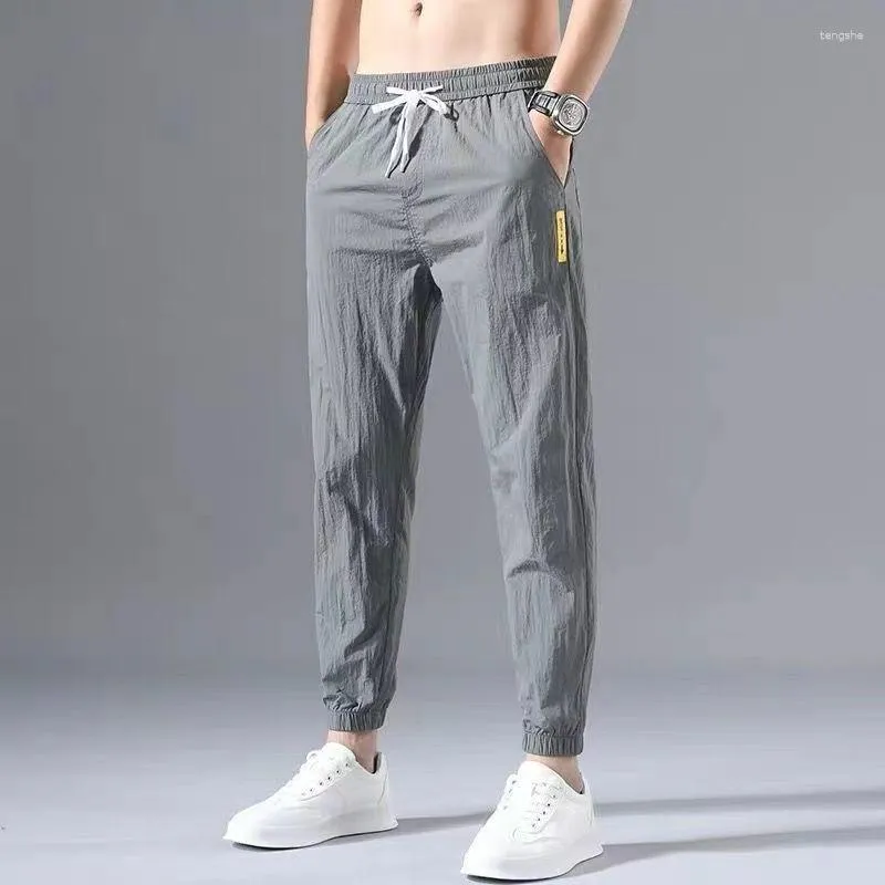 Calças masculinas primavera outono moda coreana solta casual sweatpants homens elástico cintura alta lápis masculino bolso calças de tendência de grandes dimensões