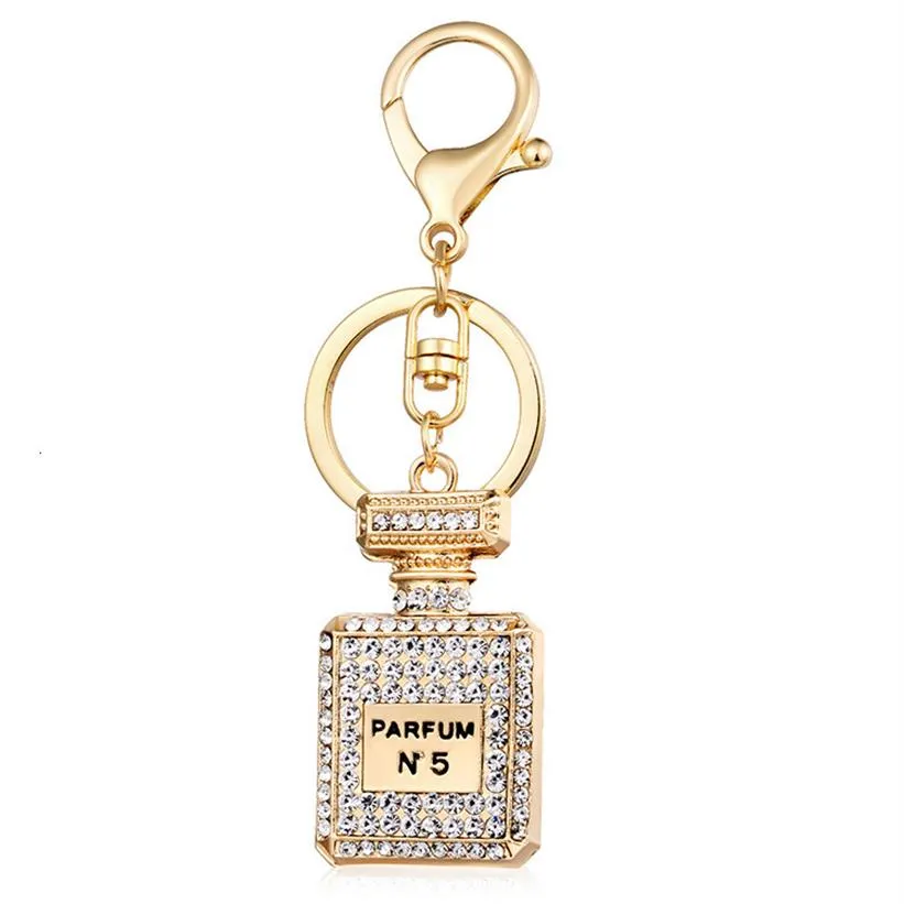 Moda criativa diamante pingente automático chaveiro garrafa de perfume chaveiro feminino pingente acessórios 264m