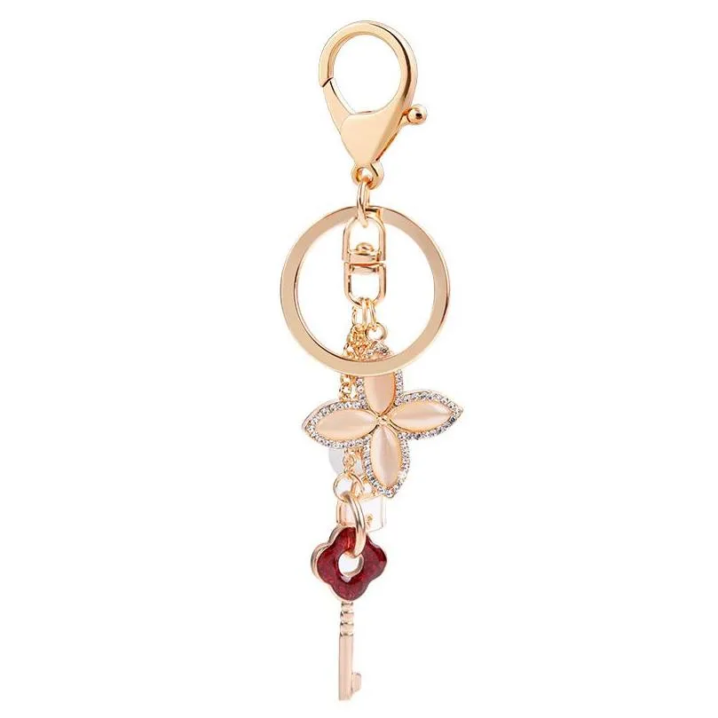 Porte-clés Love Lock Chaînes Porte-bague Opale Trèfle À Quatre Feuilles Fleur Voiture Porte-clés Femmes Hommes Bijoux Sac Pendentifs Charms Mode Couple Dhje0