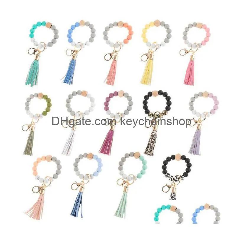 Keychains Lanyards 12 färger Sile Beads Tassel Bead String Armband Keychain Food Grade Leopard Träarmband för Women Girl Key Ri Dheek