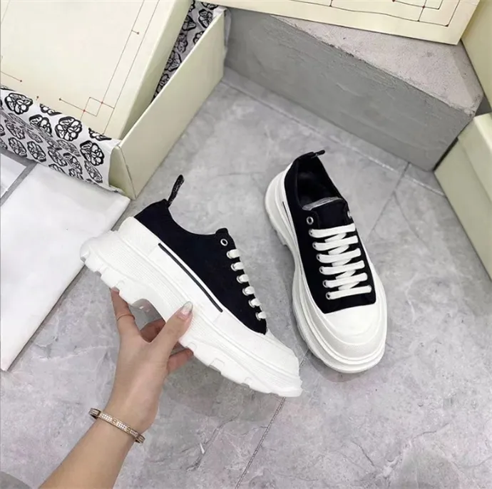 Black canvas shoes hotsell with white laces