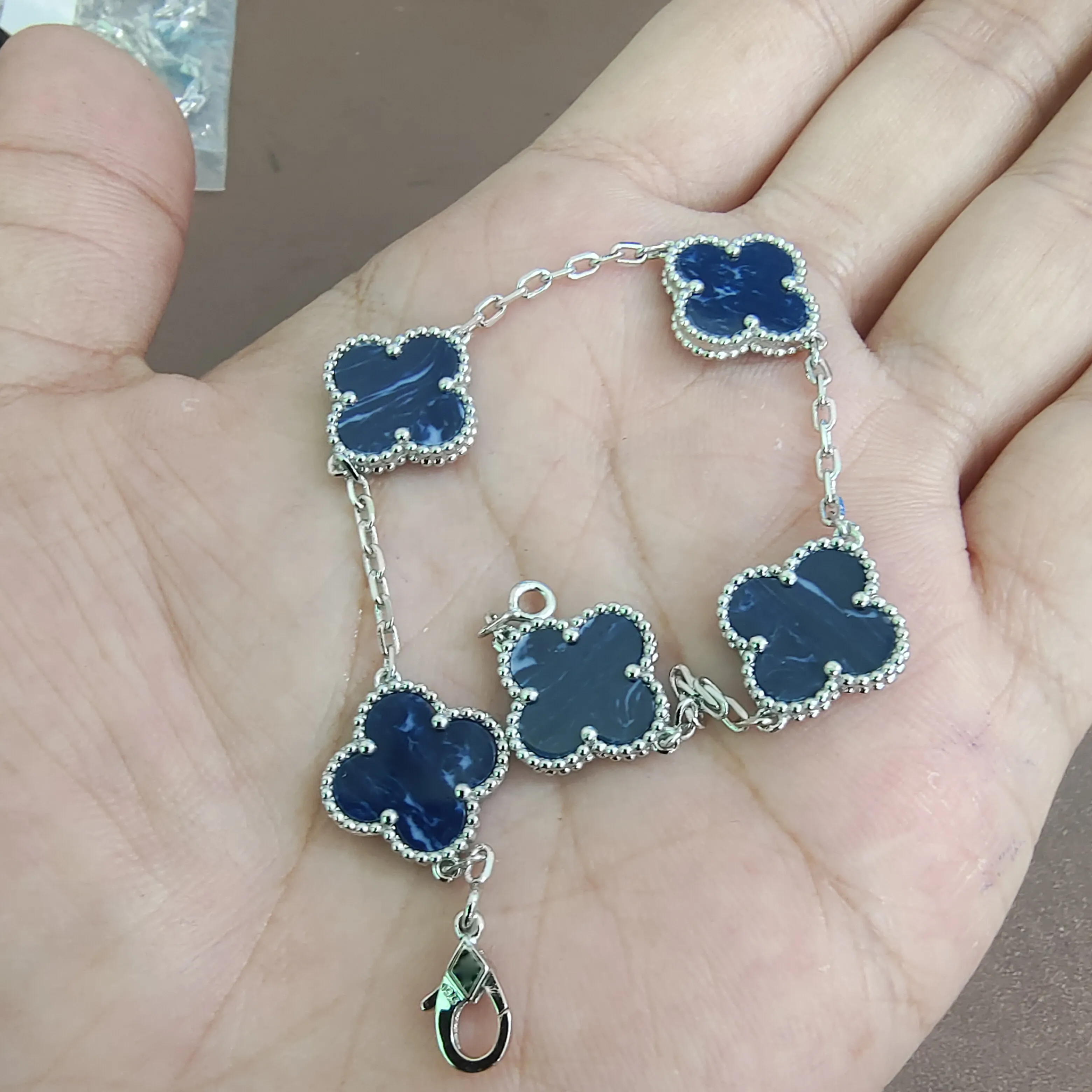 Van cleef charm bracelet deals