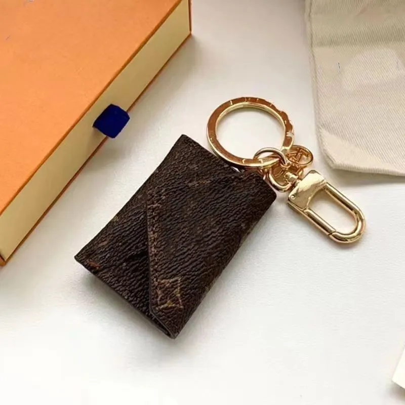 Designer Luxury Men's and Women's Letter Keychain Purse and Card Leather Simple Solid Color Universal New Clip Mini Multica for European-American Style Lovers