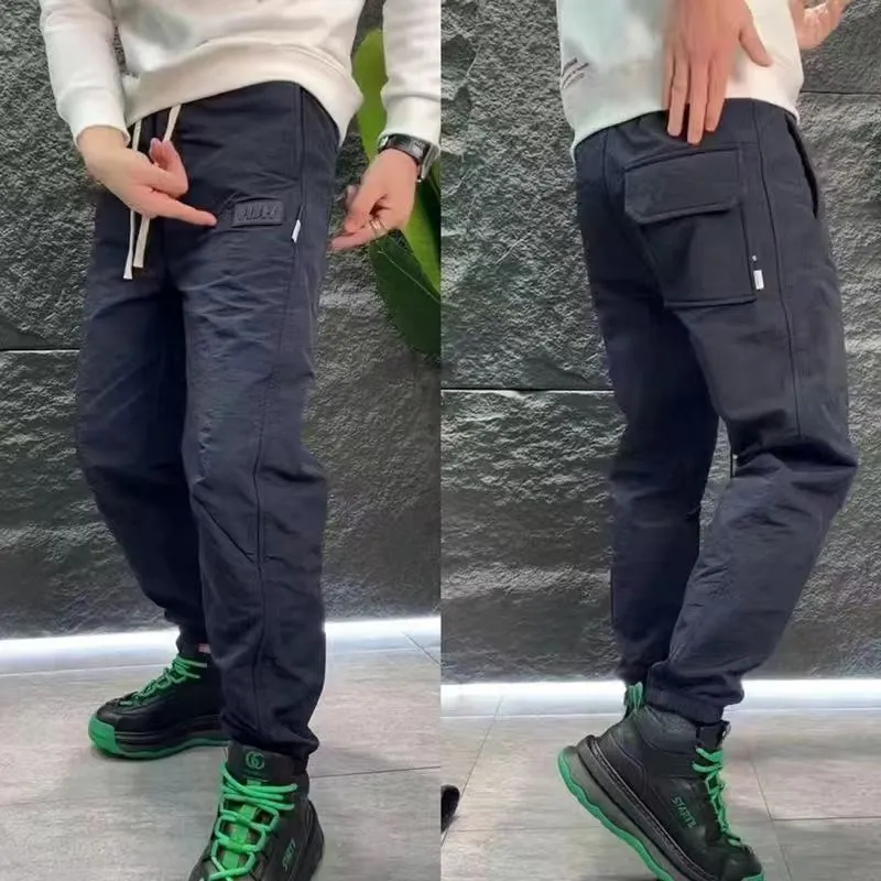 Fall New Men's Casual Pants Wysokiej klasy trójwymiarowe wytłoczone podgrzewacze nóg z nadrukiem stalowym są luźnymi spodniami Ins Harlan